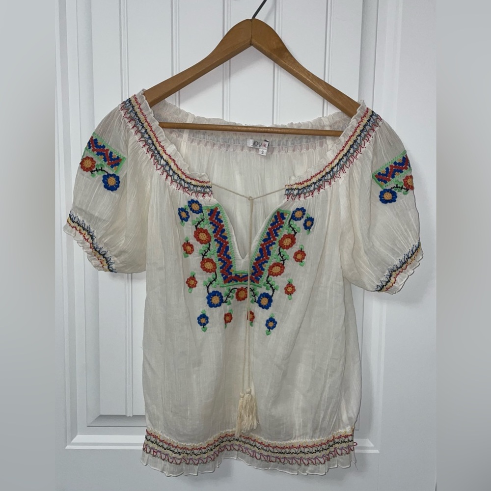 Joy Joy brand. Size Small but a little loose. White/cream color.